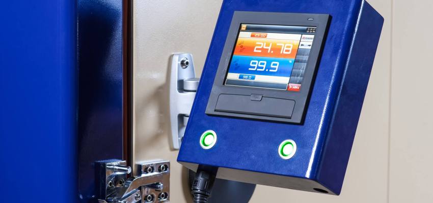 Electronic unit on vibration shaker inside environmental chamber for combined thermal vibration test