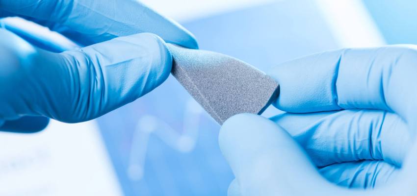 Digital rubber hardness tester measuring Shore A hardness of elastomer sample