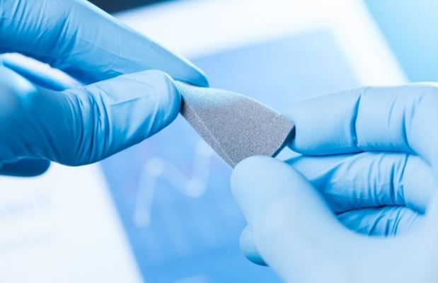 ASTM D3039 tensile test on a tabbed carbon fiber composite specimen with extensometer-Infinita Lab