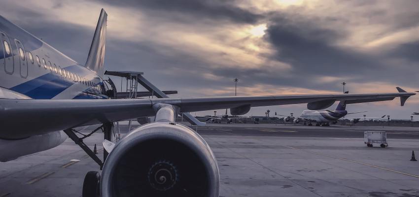 Automotive component mounted on vibration testing fixture for transportation simulation