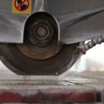 Abrasion testing machine evaluating material durability in a certified lab