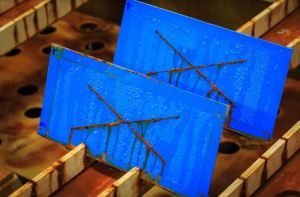 Steel and ceramic material coupons compared after identical corrosion exposure test