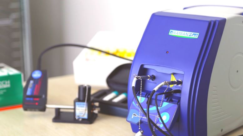 Laboratory technician performing NVM testing on a liquid sample