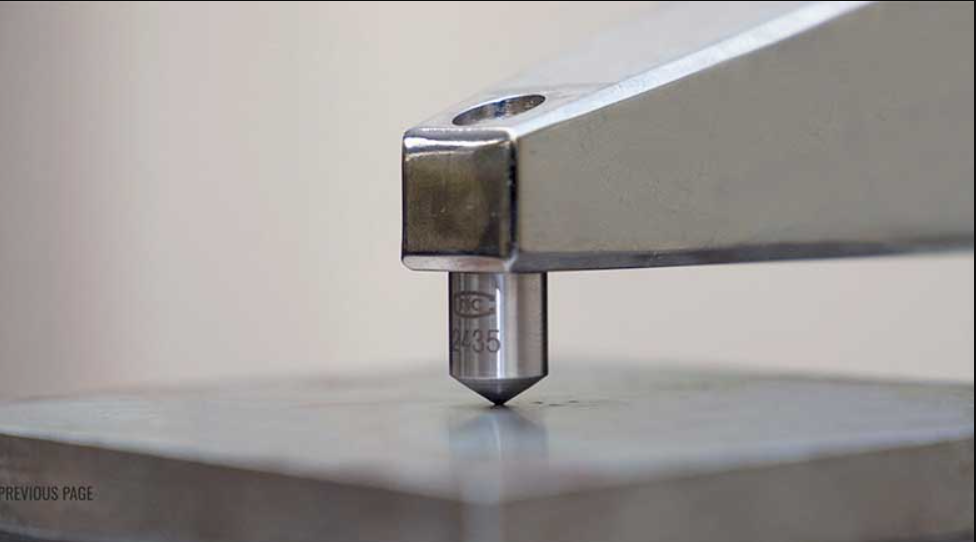 Micro Vickers hardness tester with optical microscope measuring indent on material surface