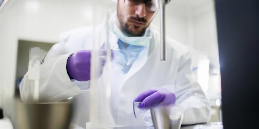 Diverse plastic products including automotive parts, packaging, and medical devices for testing