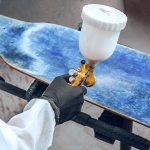 Cross-cut adhesion test on painted surface showing tape pull evaluation per ASTM D3359