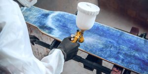 Cross-cut adhesion test on painted surface showing tape pull evaluation per ASTM D3359