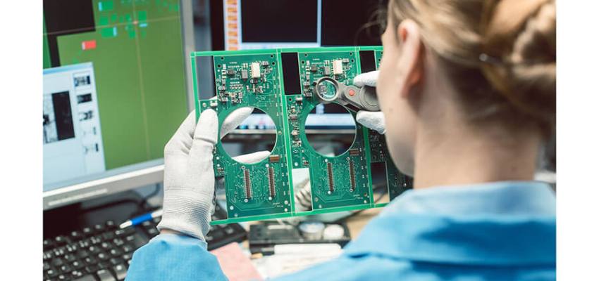 Failed industrial component being examined under stereo microscope for failure analysis