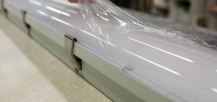 ASTM D882 tensile testing machine with plastic film specimen.