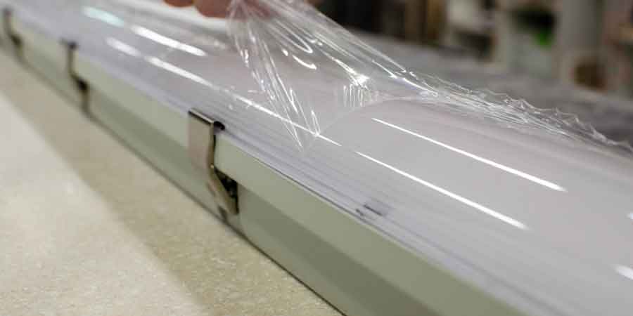 ASTM D882 tensile testing machine with plastic film specimen.