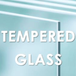 Tempered glass panel viewed through polarized filter showing stress birefringence pattern
