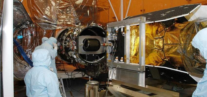 Technician performing Magnetic Particle Testing on an aerospace turbine component.